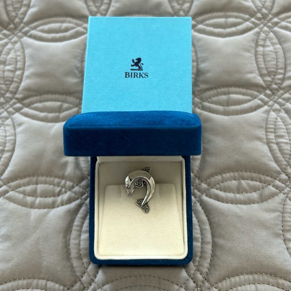 Birks fine jewelry dolphin brooch.